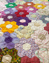 Load image into Gallery viewer, Hexagonal patchwork quilt with colorful floral patterns